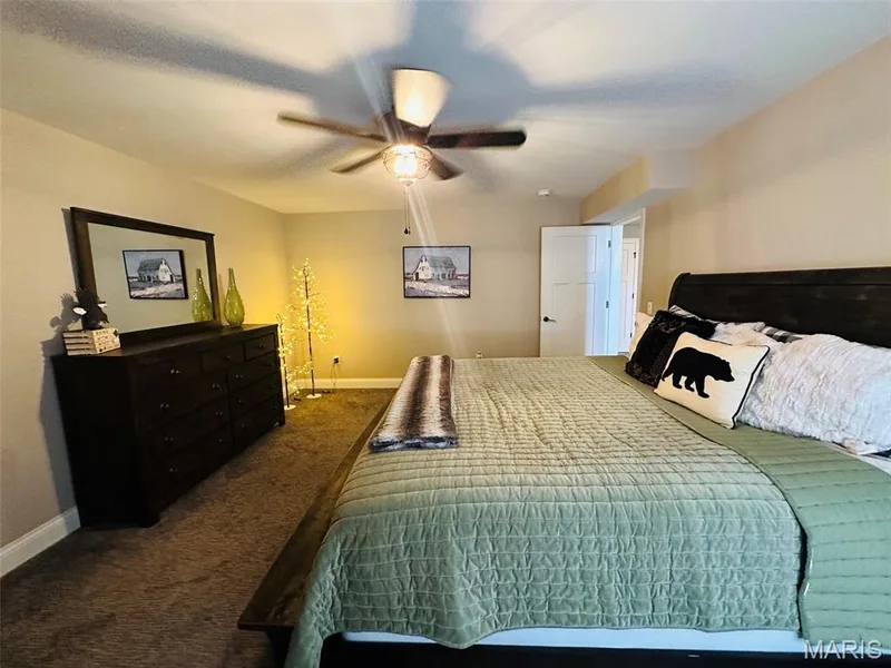 Carpeted bedroom with neutral wall tones and white baseboards — 110 Alta Mira Court, Dardenne Prairie, MO 63368