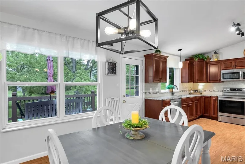 Lots of natural light and tranquil view to the back yard setting — 104 Cedar Crest Court, St Charles, MO 63304