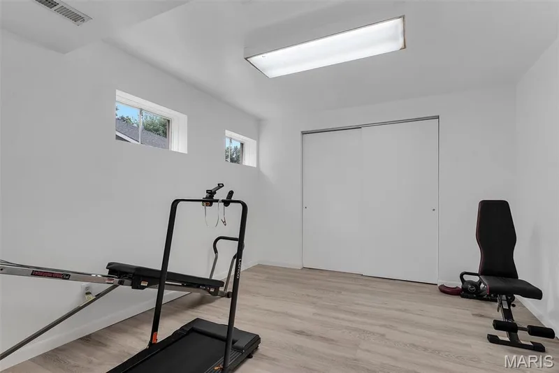 Lower Level  Flex Room could be used as a bedroom, office, or exercise room.  Room does contain closet — 104 Cedar Crest Court, St Charles, MO 63304