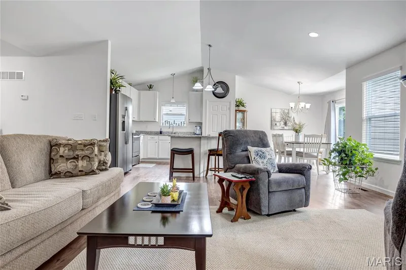 View from the open great room to kitchen and breakfast area — 492 Pleasant Breeze Drive, Wentzville, MO 63385