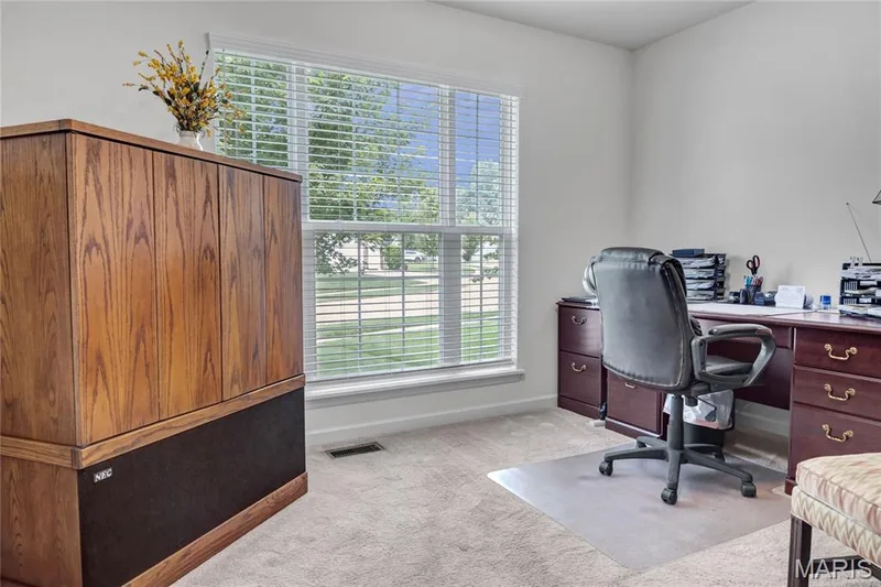 Another secondary bedroom away from the primary bedroom, currently used as an office — 492 Pleasant Breeze Drive, Wentzville, MO 63385