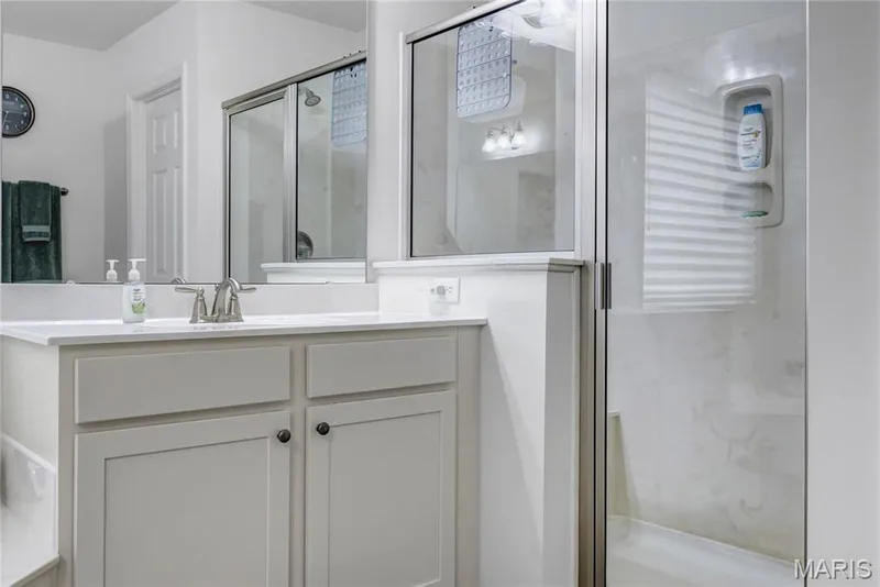 Adult height bathroom vanities in primary bathroom — 492 Pleasant Breeze Drive, Wentzville, MO 63385