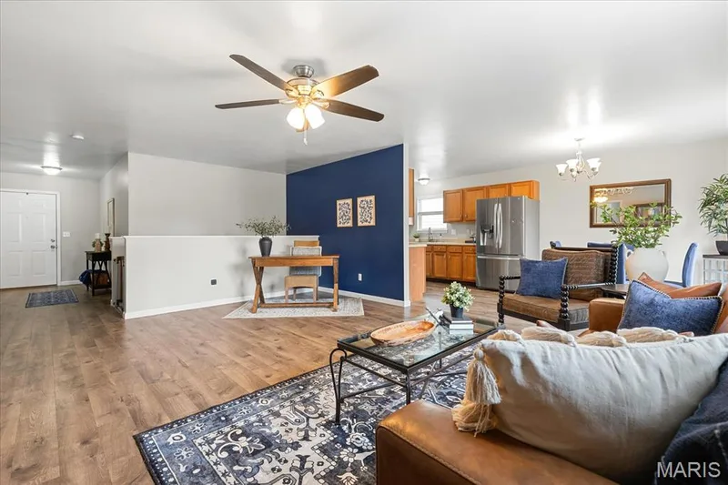 Enjoy true open-concept living where movie nights, work-from-home days, and dinner prep all share one cohesive, stylish space. — 146 Tuscany Lane, Wentzville, MO 63385