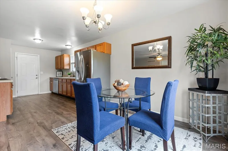 Versatile breakfast room seamlessly positioned next to the kitchen, perfect for everyday meals and entertaining. — 146 Tuscany Lane, Wentzville, MO 63385