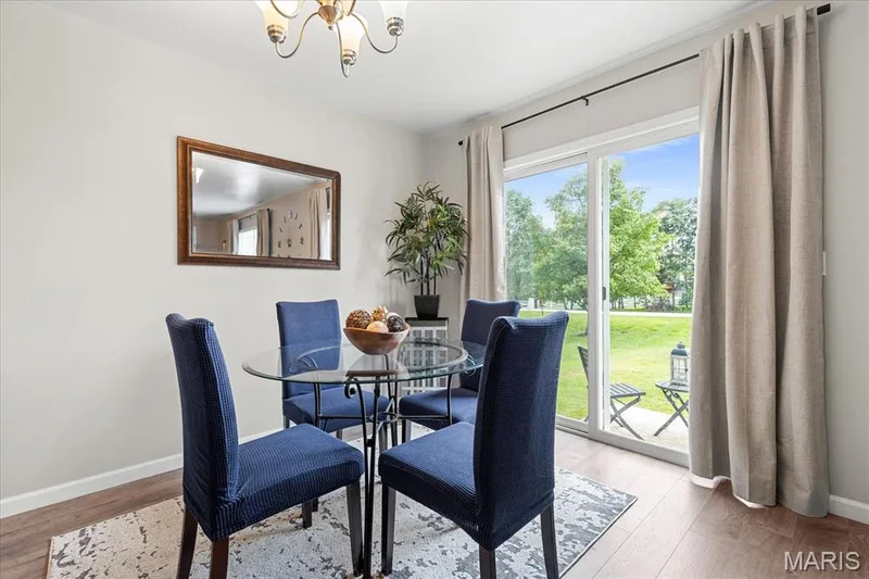 Light-filled breakfast room with sliding glass doors leading directly out to the backyard patio. — 146 Tuscany Lane, Wentzville, MO 63385