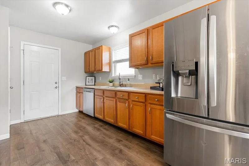 Whip up favorite meals with ease in the bright, well-organized kitchen equipped with modern stainless steel appliances and abundant storage. — 146 Tuscany Lane, Wentzville, MO 63385