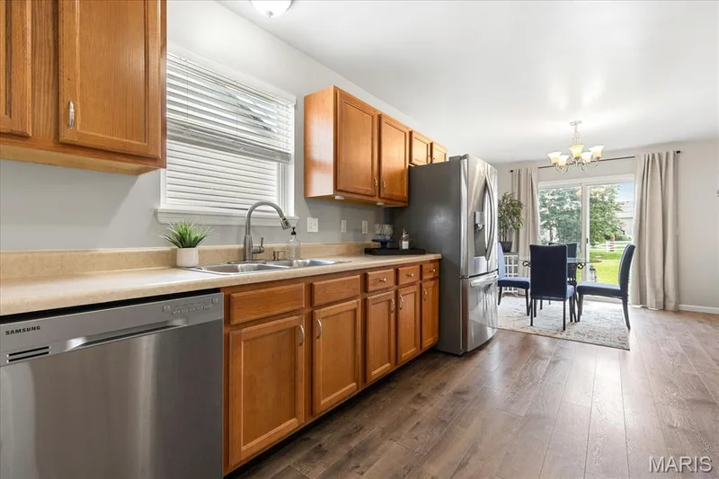 Enjoy doing the dishes with a window view and stay connected to guests in the dining area just steps away. — 146 Tuscany Lane, Wentzville, MO 63385