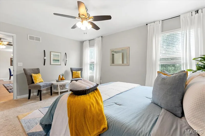 Designed for ultimate comfort, this primary bedroom suite easily fits a full furniture set plus a cozy corner reading nook. — 146 Tuscany Lane, Wentzville, MO 63385