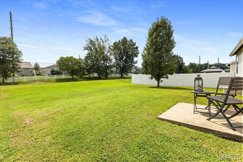 Unwind on your private back patio while taking in the open views across the spacious green yard. — 146 Tuscany Lane, Wentzville, MO 63385