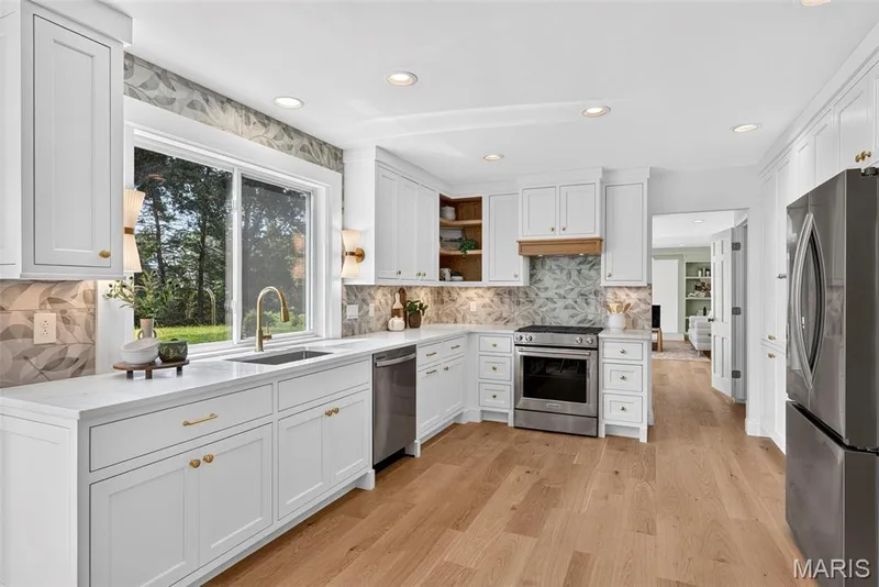 Custom built cabinets with slow close hardware,  new stainless appliances, and new window and light fixtures. — 2251 Whitby Road, Chesterfield, MO 63017