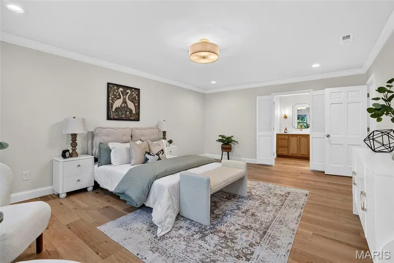 Spacious primary bedroom with attached spa inspired bathroom and open to the custom closet. — 2251 Whitby Road, Chesterfield, MO 63017
