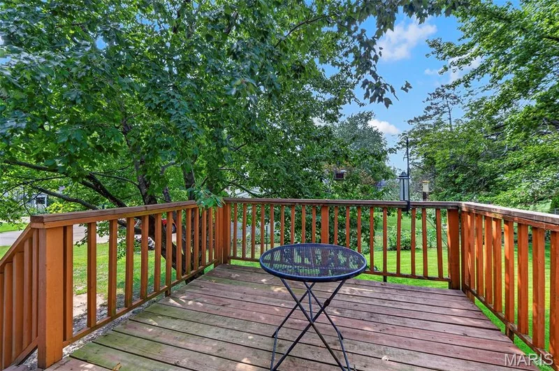 Spacious outdoor deck featuring natural wood flooring and a perimeter railing — 1319 Brandywine Lane, St Peters, MO 63376