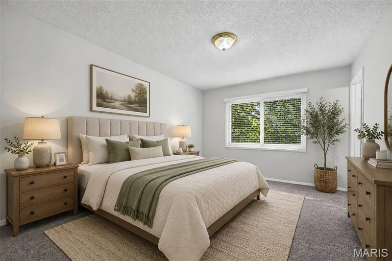 Neutral paint palette, plush carpet flooring, large window with blinds, recessed lighting, and a paneled headboard — 1319 Brandywine Lane, St Peters, MO 63376