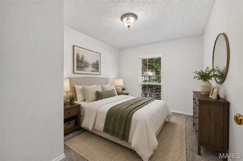Recessed window with blinds, overhead lighting, textured ceiling, and neutral wall color — 1319 Brandywine Lane, St Peters, MO 63376