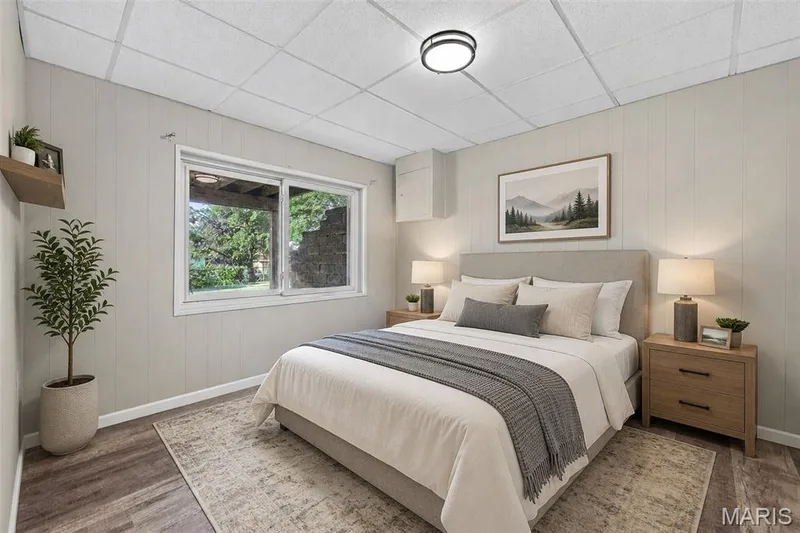Wood-finish flooring, drop-panel ceiling, and horizontal wall paneling — 1319 Brandywine Lane, St Peters, MO 63376