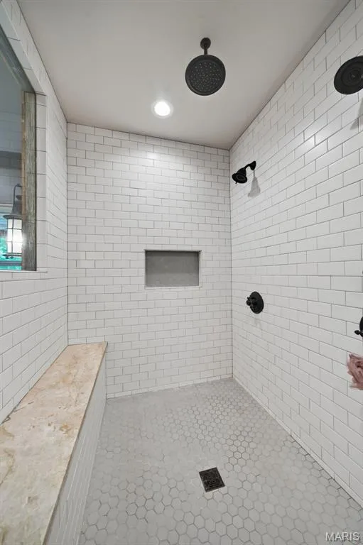 Tiled surround shower with bench seating featuring three shower heads, including a waterfall — 1950 Diehr Road, Wentzville, MO 63385