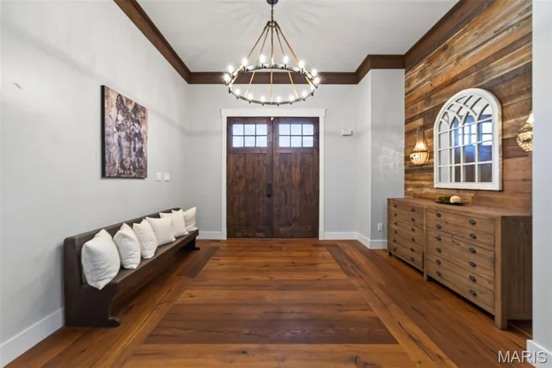 Entry foyer with wood feature wall and circle chandelier — 1950 Diehr Road, Wentzville, MO 63385