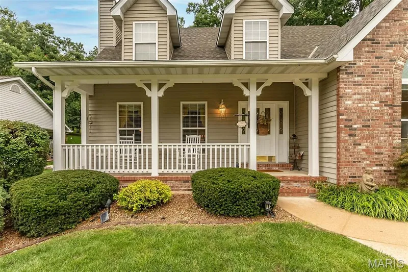Enjoy views of common grounds across the street while sitting on your covered front porch! — 868 Natchez Drive, St Charles, MO 63303