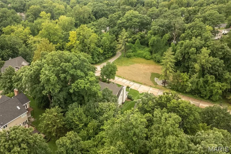 Common ground and trees across the street in the front of the house — 868 Natchez Drive, St Charles, MO 63303
