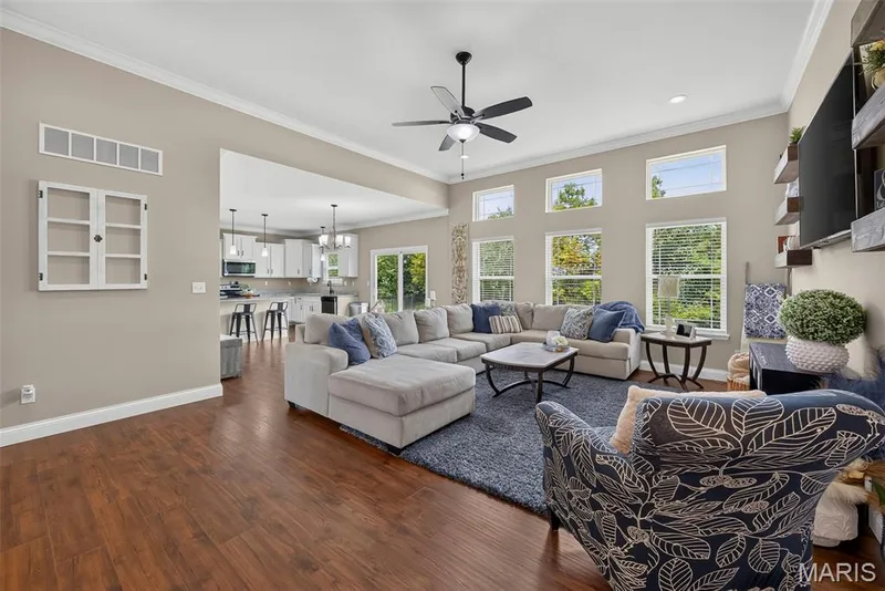 11 foot ceilings in the great room with transom windows for added natural light. — 103 Pomodora Circle, Wentzville, MO 63385