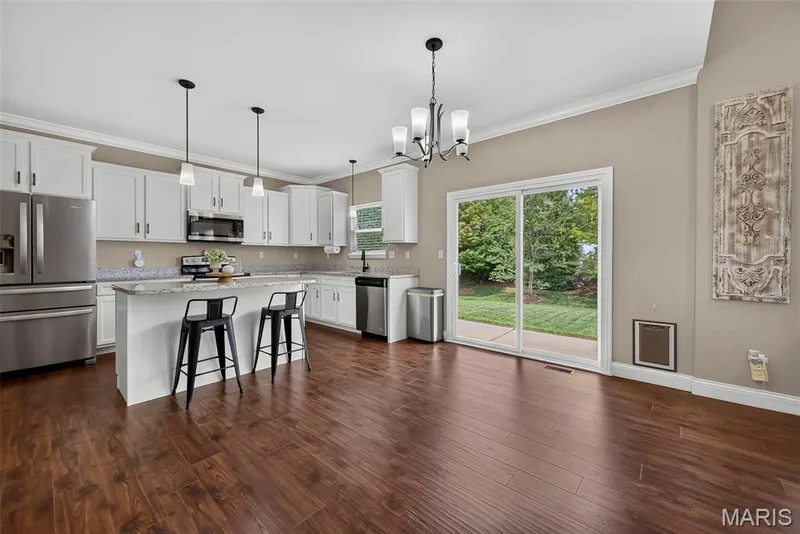 Luxury vinyl plank flooring throughout with sliding door to spacious patio (17' X 9') — 103 Pomodora Circle, Wentzville, MO 63385