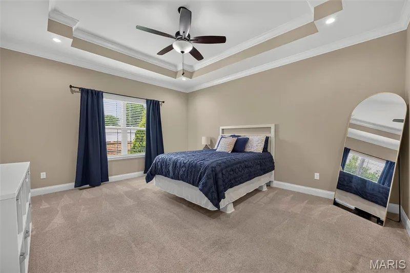 Primary suite with tray ceiling, walk-in closet with custom shelving system and beautiful bathroom — 103 Pomodora Circle, Wentzville, MO 63385