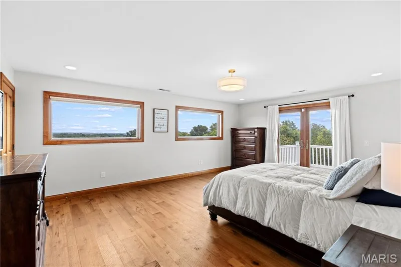 Hardwood flooring, recessed lighting, and a drum pendant light fixture — 205 Howell Road, Defiance, MO 63341