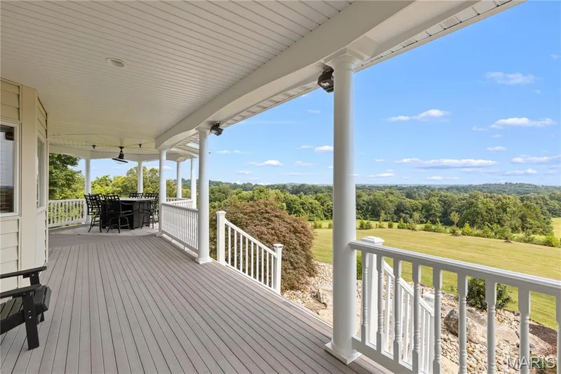 Expansive deck with composite decking and white railings — 205 Howell Road, Defiance, MO 63341