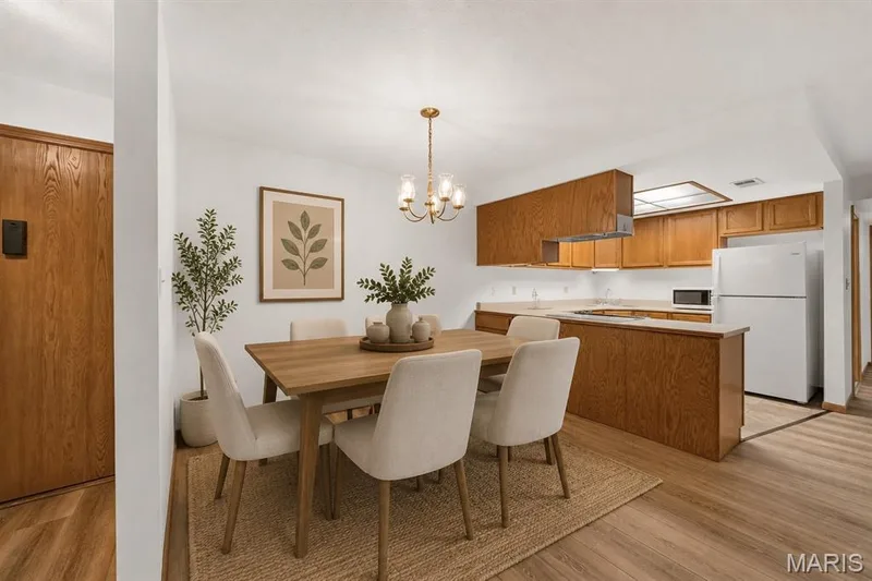 VIRTUALLY STAGED DINING AREA — 1440 Heritage Landing #201, St Charles, MO 63303