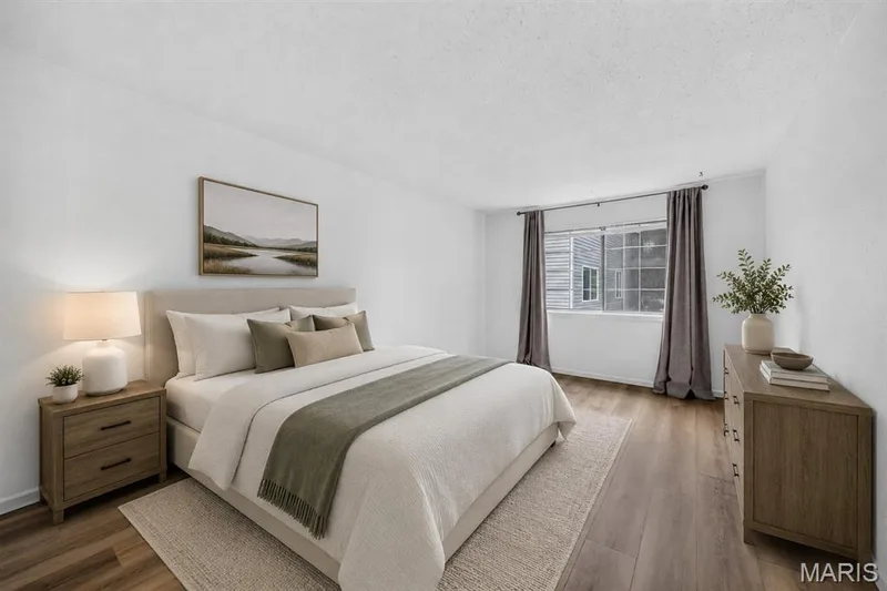 VIRTUALLY STAGED PRIMARY BEDROOM — 1440 Heritage Landing #201, St Charles, MO 63303