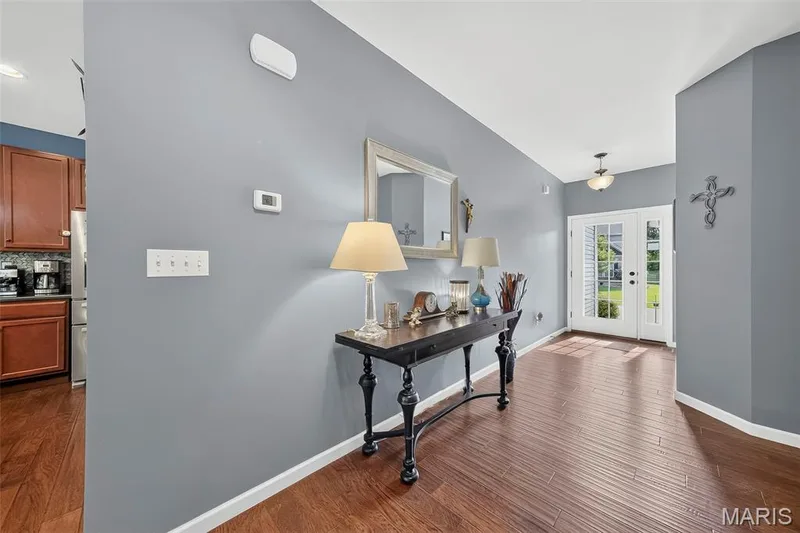 Step in and you are greeted with gleaming hardwood floors. — 1125 Crystal Creek Parkway, Wentzville, MO 63385