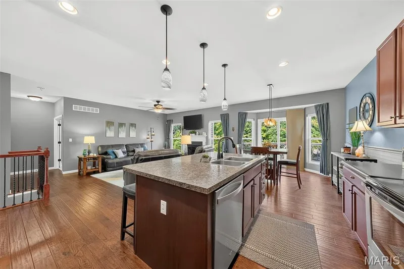 The kitchen offers an expansive center island. — 1125 Crystal Creek Parkway, Wentzville, MO 63385