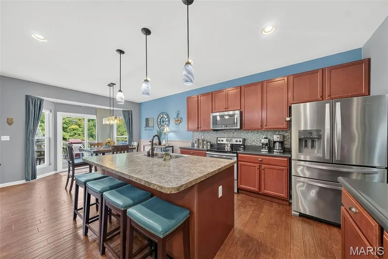Stainless Steel Appliances and Custom 42" Cabinetry complete this space. — 1125 Crystal Creek Parkway, Wentzville, MO 63385