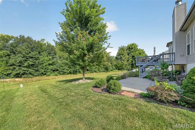 Step out back and admire all the beautiful trees. — 1125 Crystal Creek Parkway, Wentzville, MO 63385
