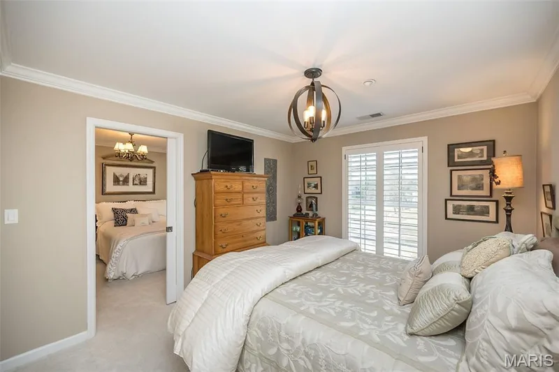 Pocket door separates the 2 guest bedrooms — 1512 Bedford Forge Court #19, Chesterfield, MO 63017