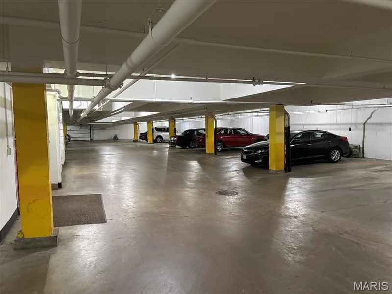 View of parking garage, where there are 2 reserved spaces close to elevator — 1512 Bedford Forge Court #19, Chesterfield, MO 63017