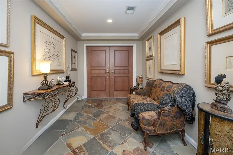 Foyer has slate tile flooring, recessed lighting, and crown molding. — 1512 Bedford Forge Court #19, Chesterfield, MO 63017