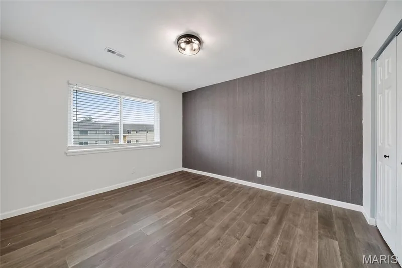 Large windows, accent wall, and nice size closet — 1823 Gascony Parc Drive #1823, Lake St. Louis, MO 63367