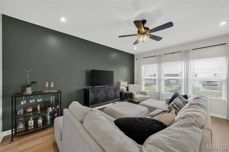 Living room boasting lots of natural light. — 2211 Eagle River Drive, O'Fallon, MO 63366