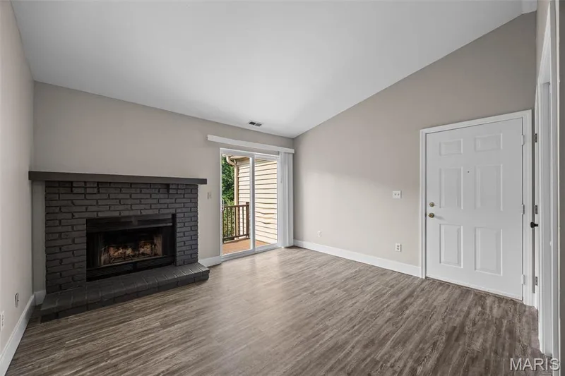 Living Room steps out to private balcony. — 2419 Sandalwood Creek Court #F, Wildwood, MO 63038