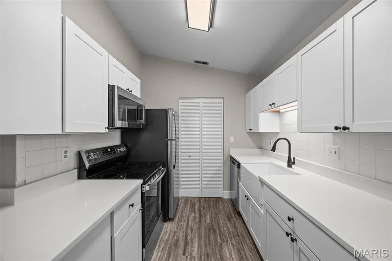 Plenty of counter space. Laundry closet at back of kitchen. — 2419 Sandalwood Creek Court #F, Wildwood, MO 63038