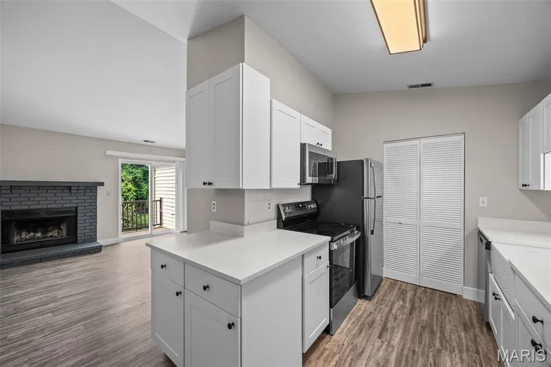 View into Kitchen and Living Room — 2419 Sandalwood Creek Court #F, Wildwood, MO 63038