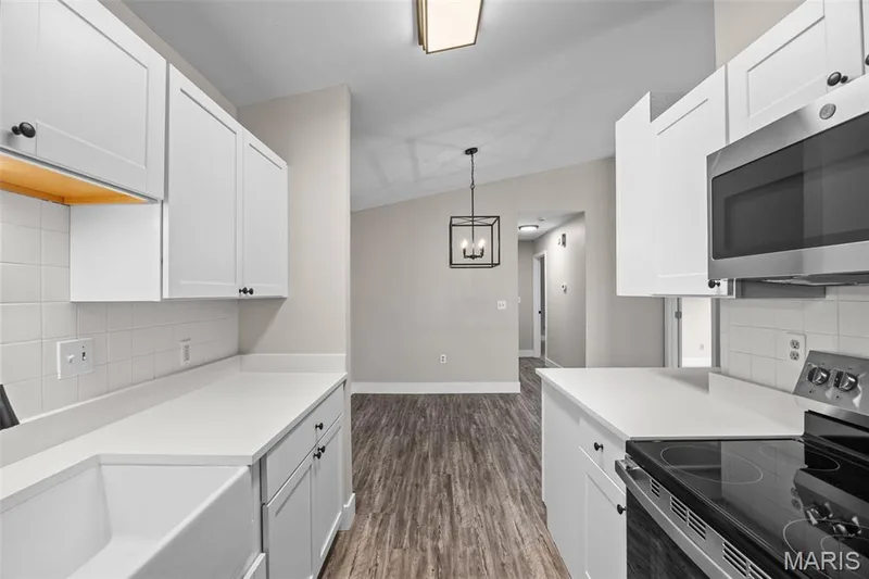 View from Kitchen to Dining Room — 2419 Sandalwood Creek Court #F, Wildwood, MO 63038
