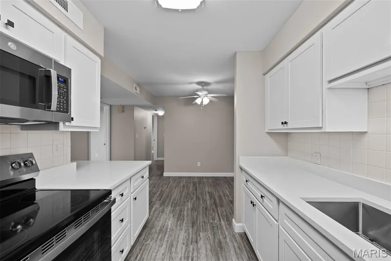 View from Kitchen to Dining Room — 2343 Sandalwood Creek Court #C, Wildwood, MO 63038