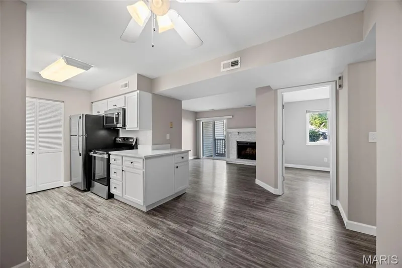 View from Dining Room to Kitchen and Living Room. — 2343 Sandalwood Creek Court #C, Wildwood, MO 63038