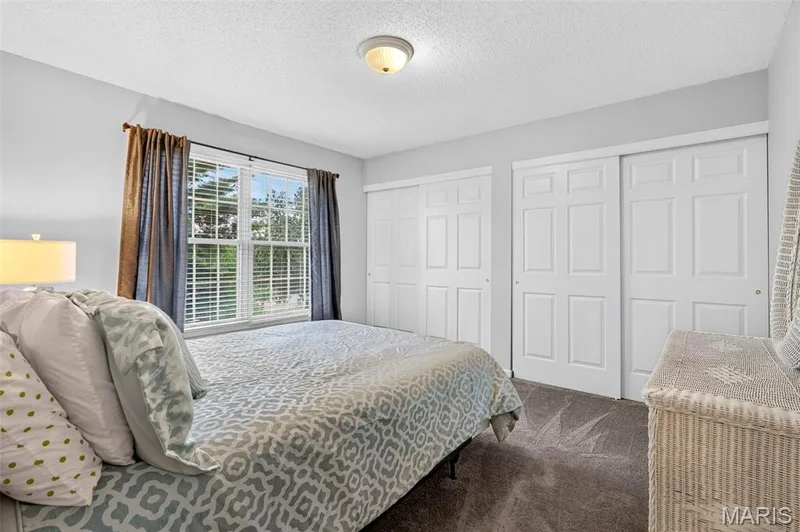 Bedroom #2 features Double Closets — 307 Camilla Drive, O'Fallon, MO 63366