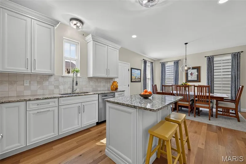 Kitchen Remodeled in 2020 With Engineered Hardwood, 42" Cabinets, Granite Countertops, Wolf Gas Stove with Wolf Hood, Double Door Bosch Refrigerator, and Bosch Dishwasher. — 3253 Camp Street, St Charles, MO 63301
