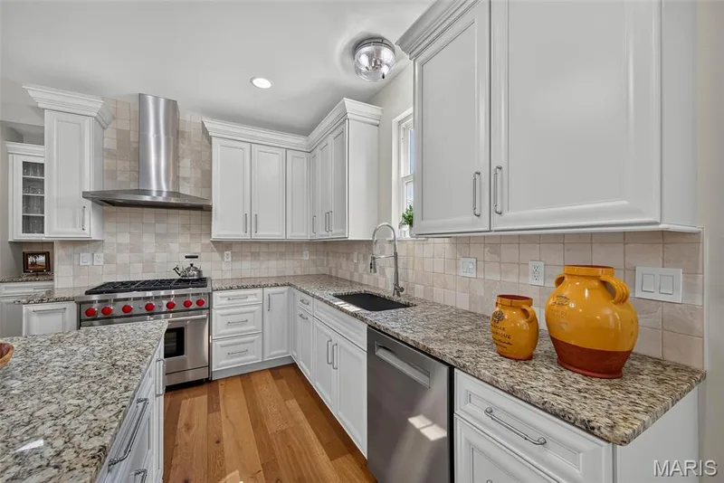 Kitchen Remodeled in 2020 With Engineered Hardwood, 42" Cabinets, Granite Countertops, Wolf Gas Stove with Wolf Hood, Double Door Bosch Refrigerator, and Bosch Dishwasher. — 3253 Camp Street, St Charles, MO 63301