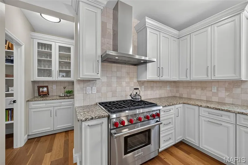 Kitchen Remodeled in 2020 With Engineered Hardwood, 42" Cabinets, Granite Countertops, Wolf Gas Stove with Wolf Hood, Double Door Bosch Refrigerator, and Bosch Dishwasher. — 3253 Camp Street, St Charles, MO 63301