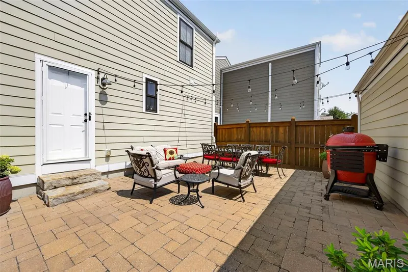 Beautiful Courtyard with Bistro Lights and Storm Door Entry Into the House — 3253 Camp Street, St Charles, MO 63301